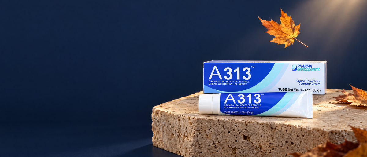 A313 retinol cream tube and box on a stone plinth with a falling autumn maple leaf